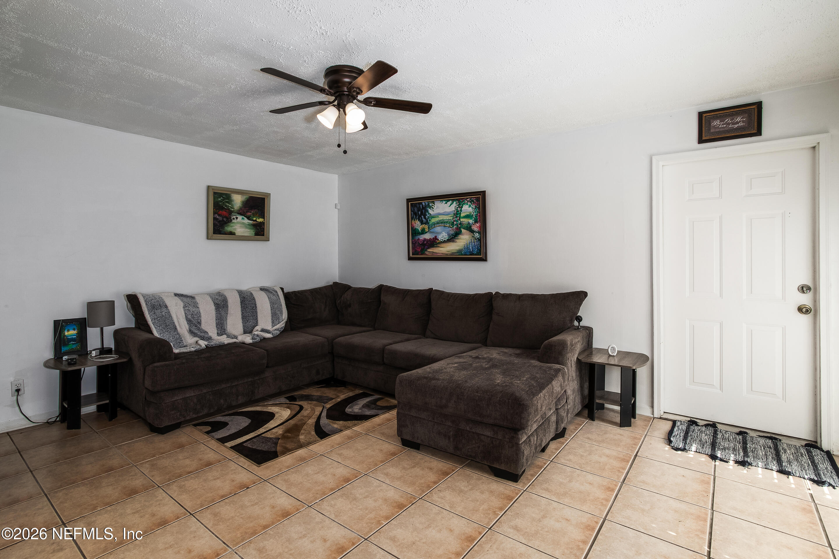 11401 Old Plank Road Jacksonville, FL 32220 - Photo 39 of 42 a living room with furniture and a ceiling fan