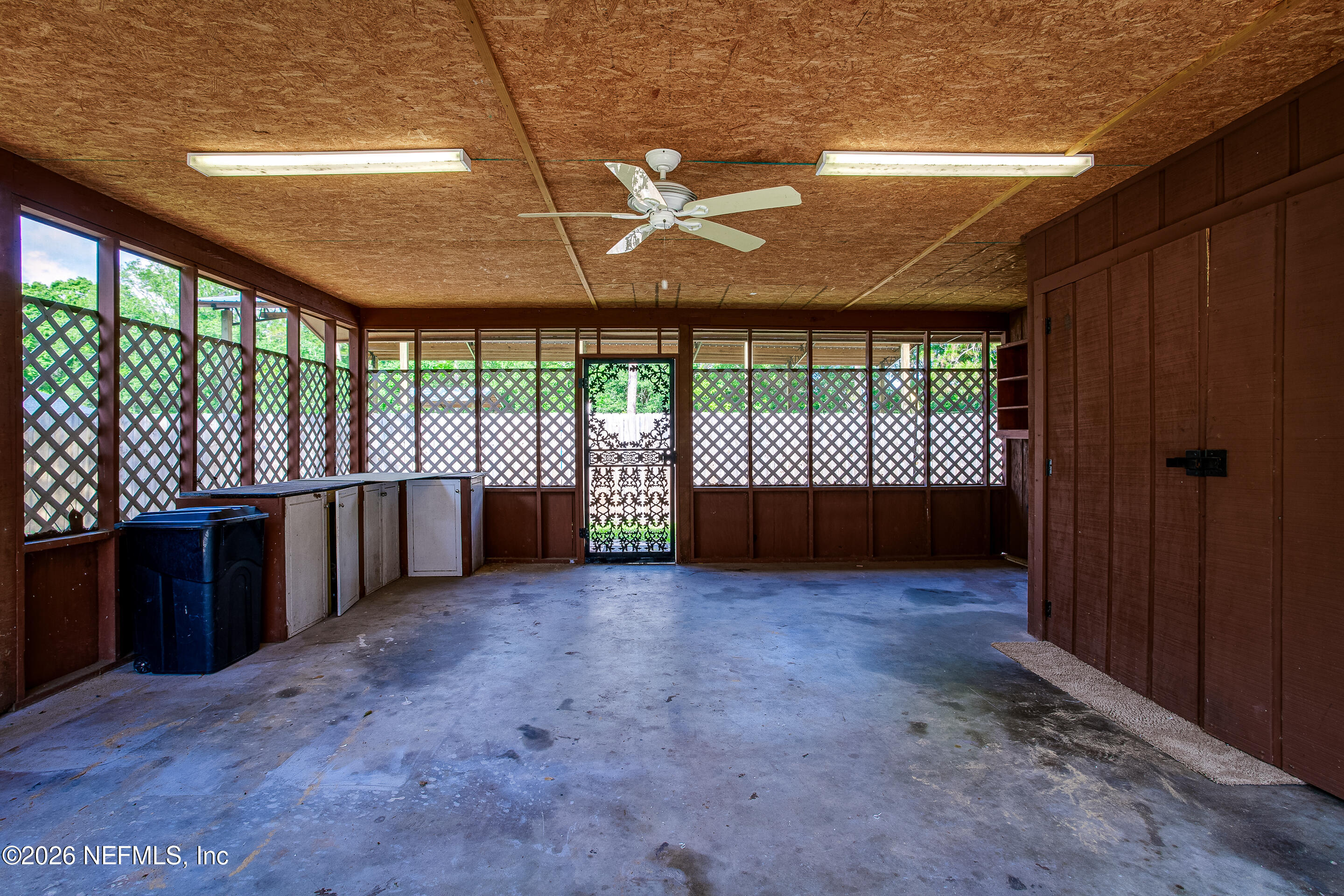 11401 Old Plank Road Jacksonville, FL 32220 - Photo 40 of 42 an empty room with a balcony and large window