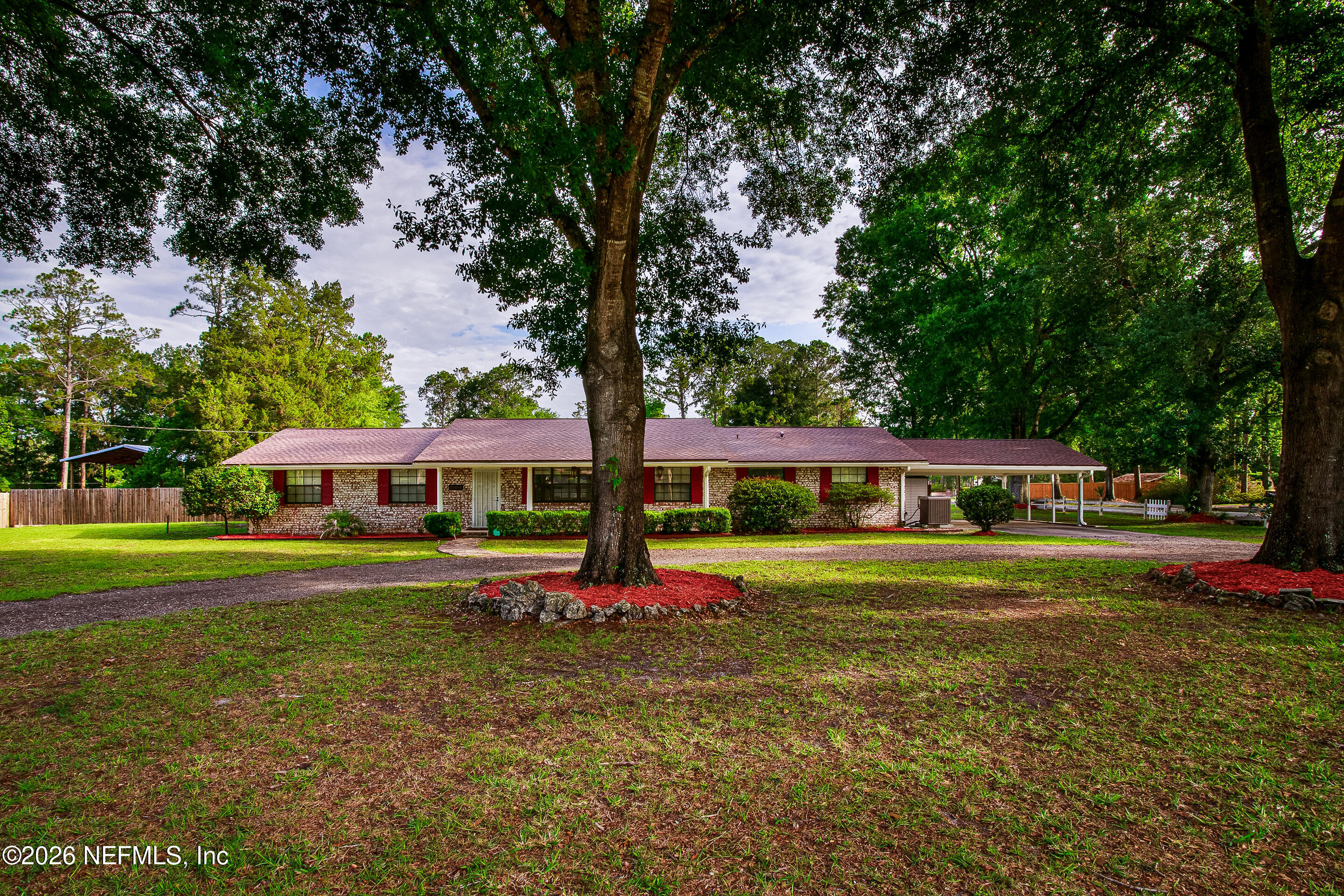 11401 Old Plank Road Jacksonville, FL 32220 - Photo 8 of 42 a front view of a house with a yard
