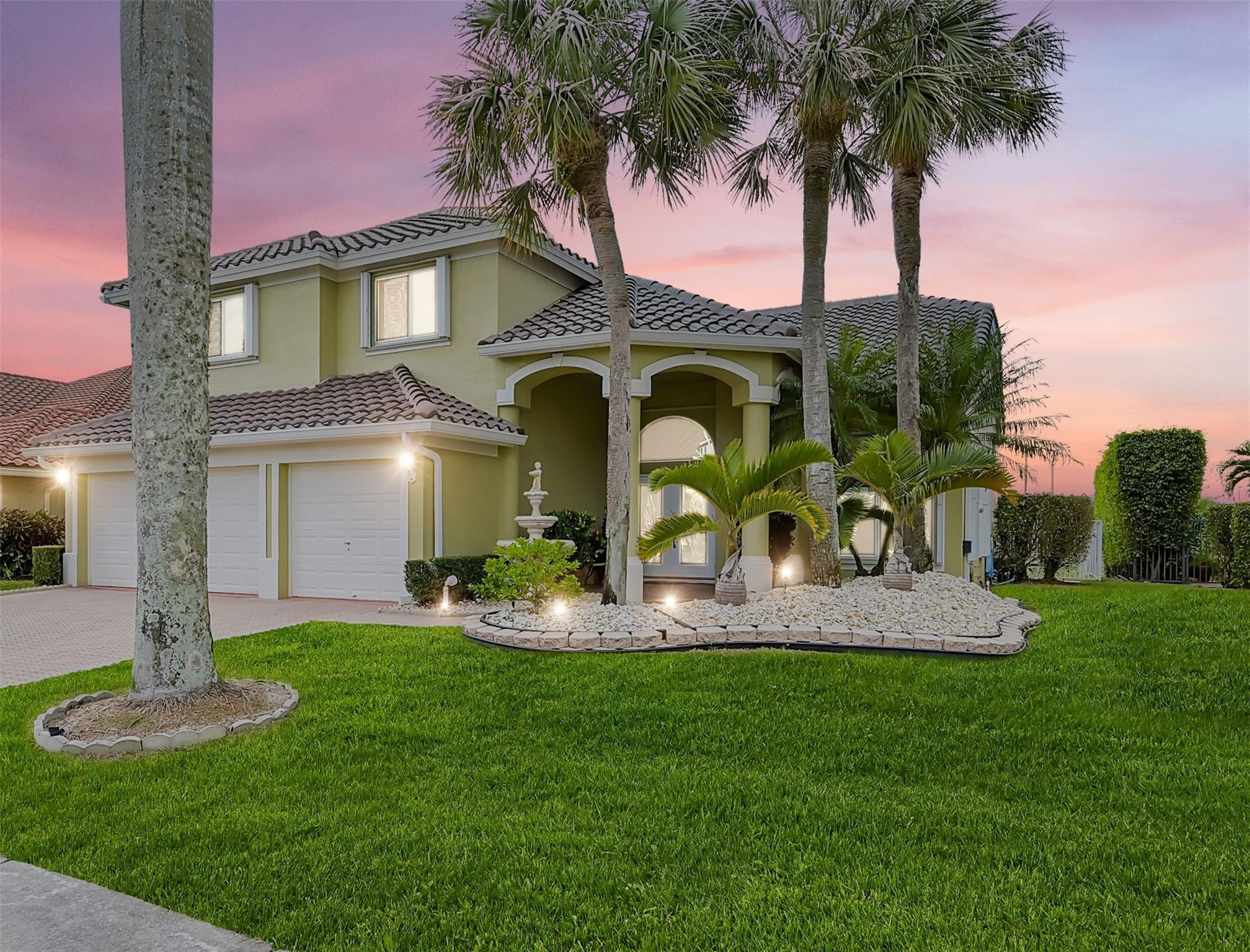 19640 Dinner Key Drive Boca Raton, FL 33498 - Photo 1 of 44 a view of a house with a yard and palm trees