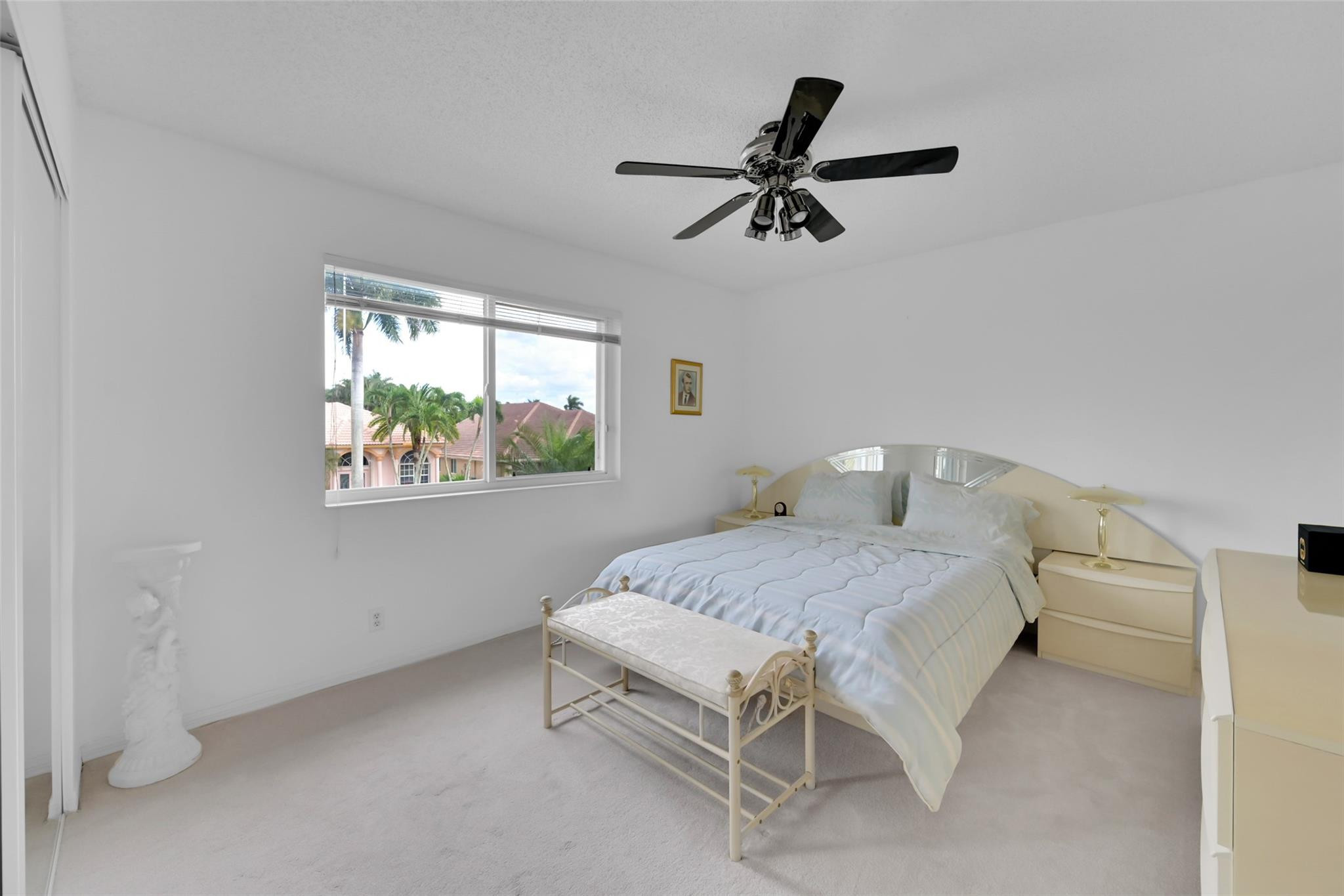 19640 Dinner Key Drive Boca Raton, FL 33498 - Photo 20 of 44 a bedroom with a bed and window