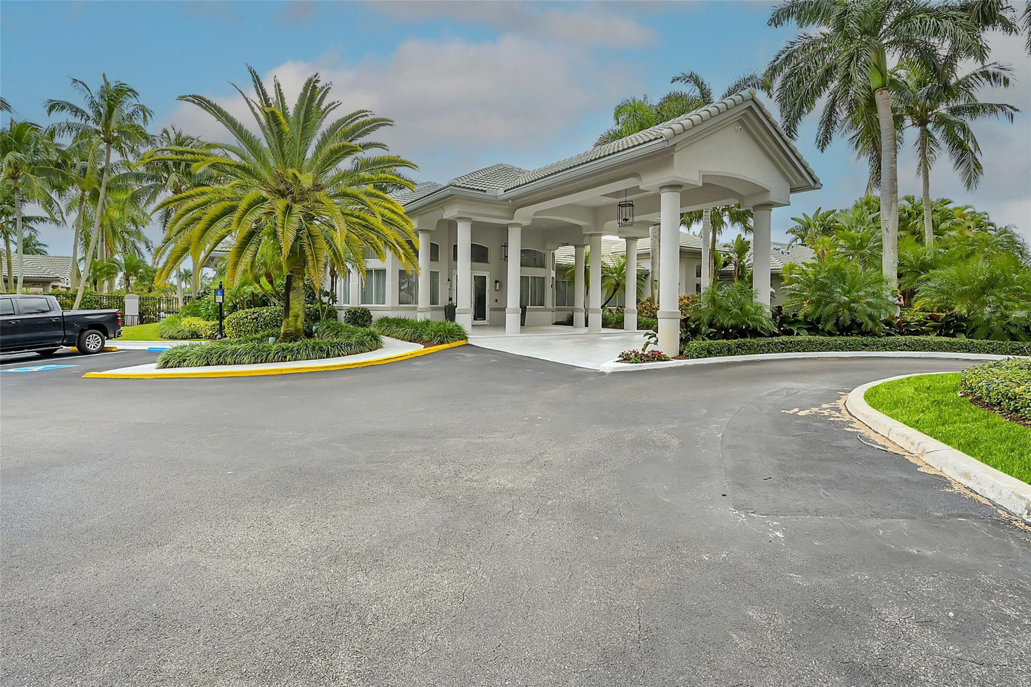 19640 Dinner Key Drive Boca Raton, FL 33498 - Photo 30 of 44 a view of a house with a patio and a yard