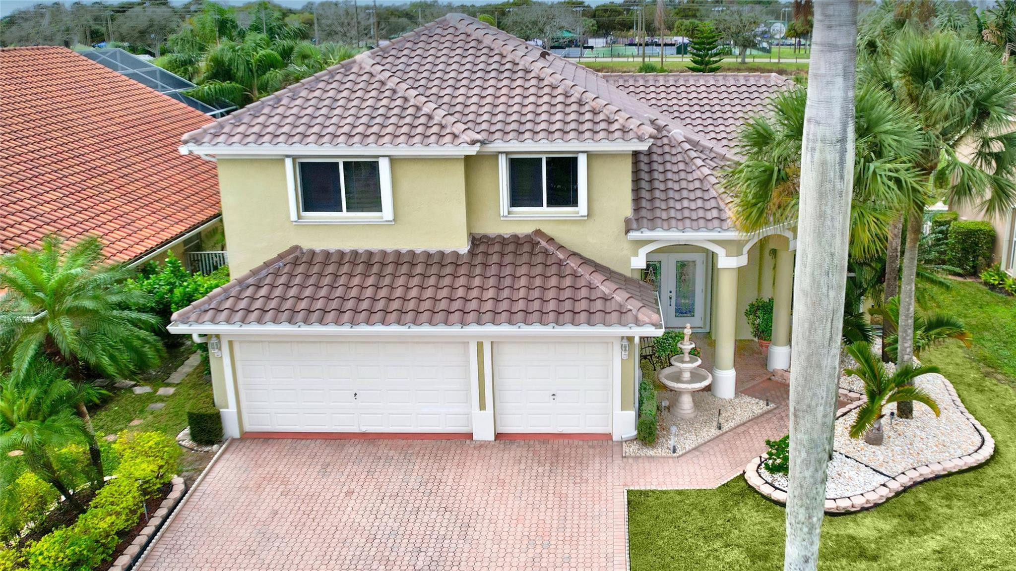 19640 Dinner Key Drive Boca Raton, FL 33498 - Photo 43 of 44 a front view of a house with garden