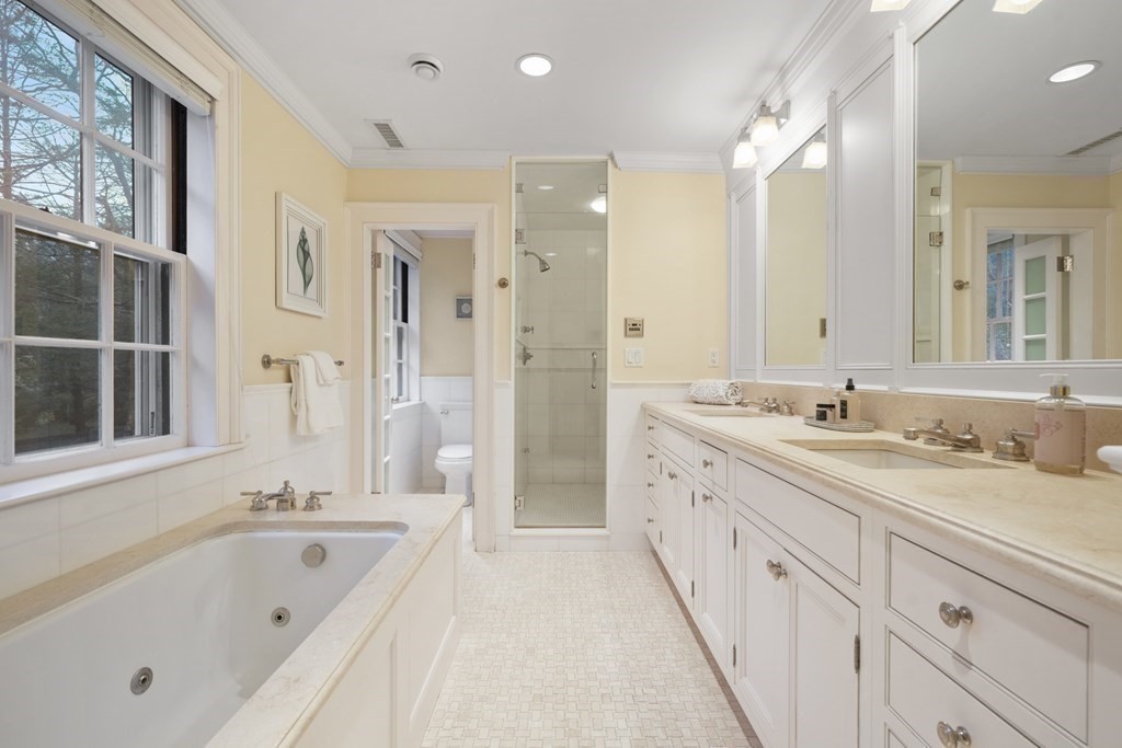 20 Sears Road Brookline, MA 02445 - Photo 25 of 40 a spacious bathroom with a granite countertop sink mirror and a bath tub