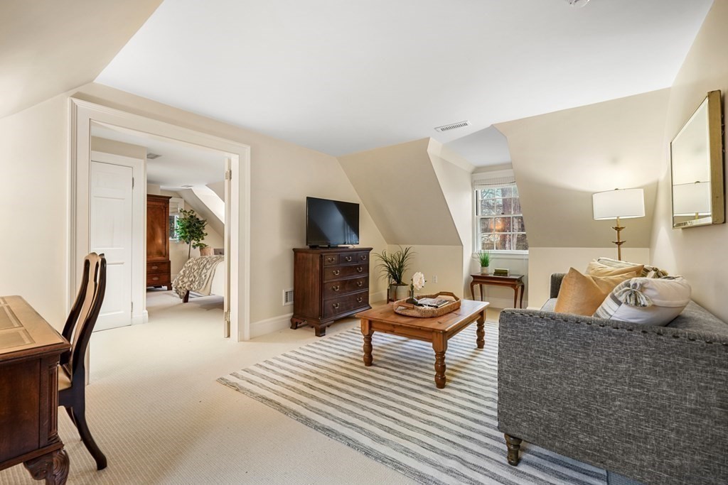 20 Sears Road Brookline, MA 02445 - Photo 26 of 40 a living room with furniture and a wooden floor