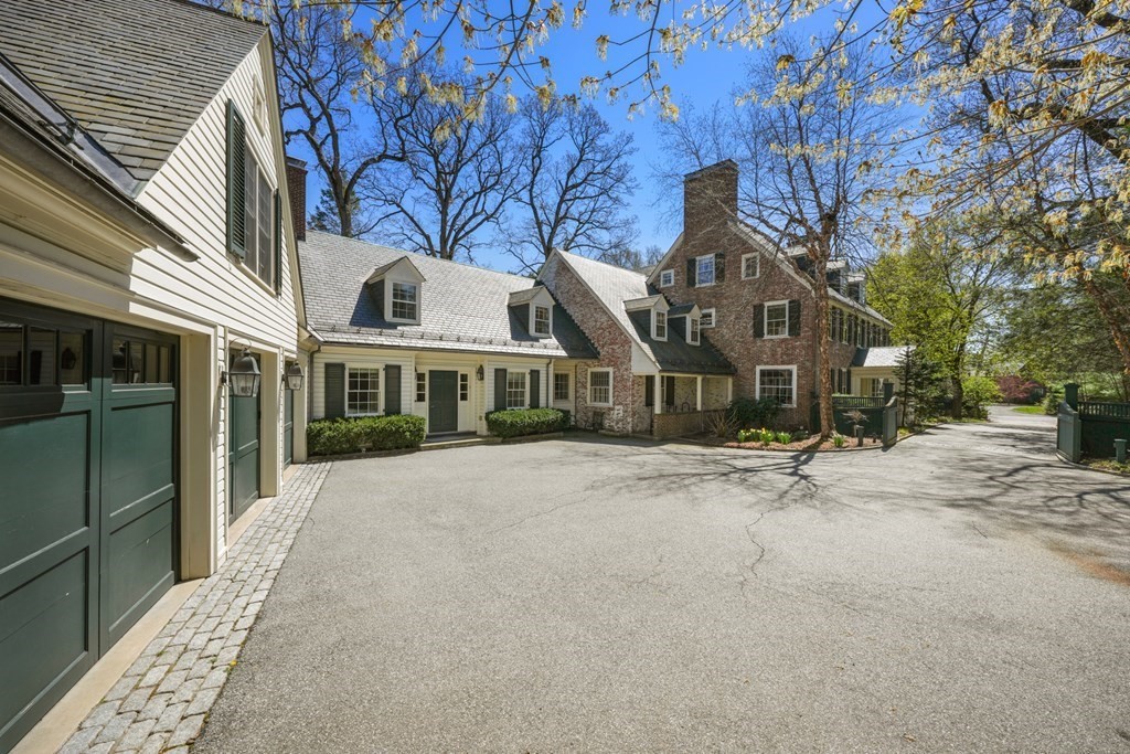 20 Sears Road Brookline, MA 02445 - Photo 36 of 40 a front view of a house with a garden