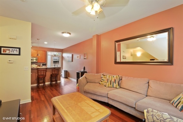 1244 West Monroe Street, Unit 7 Chicago, IL 60607 - Photo 3 of 12 a living room with furniture and a large window