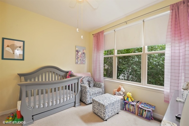 1244 West Monroe Street, Unit 7 Chicago, IL 60607 - Photo 6 of 12 a bedroom with furniture and a window