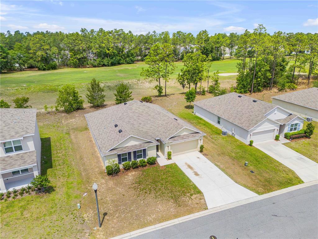 48 Hickory Loop Ocala, FL 34472 - Photo 3 of 52 an aerial view of house with a yard