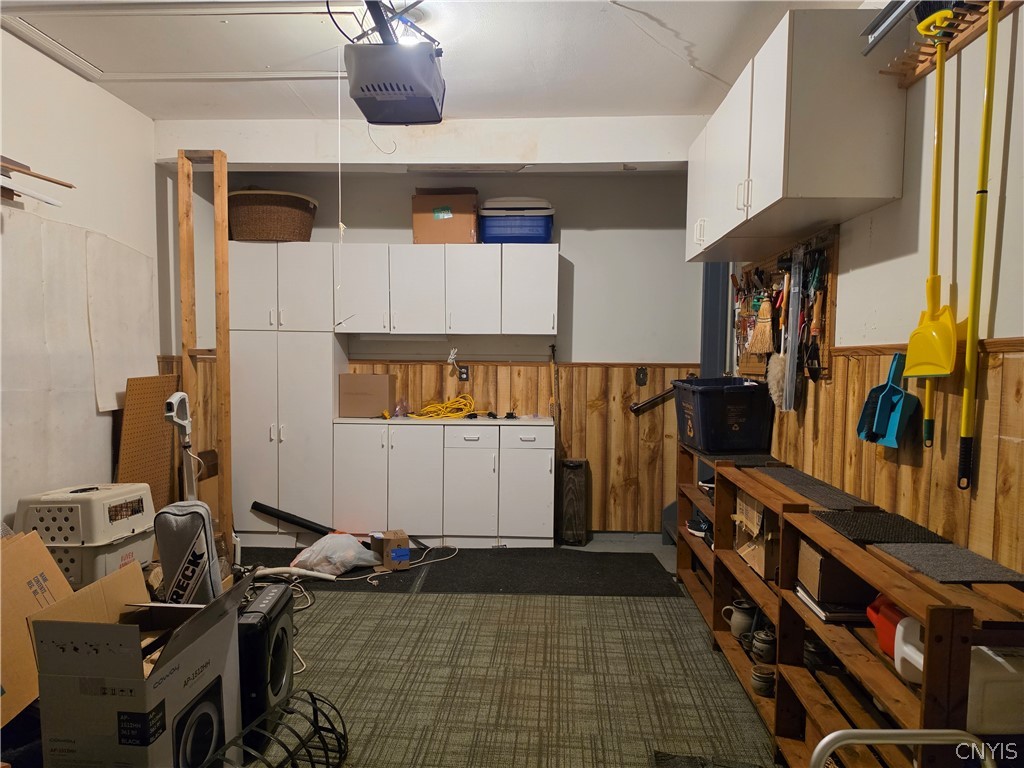 6147 Diffin Road Cicero, NY 13039 - Photo 34 of 45 Garage shelving (conveys) and pull down stairs for