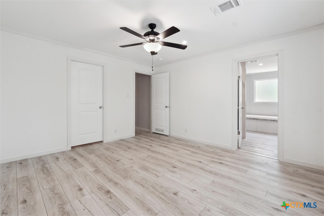 855 Roosevelt Road Luling, TX 78648 - Photo 19 of 47 wooden floor in an empty room