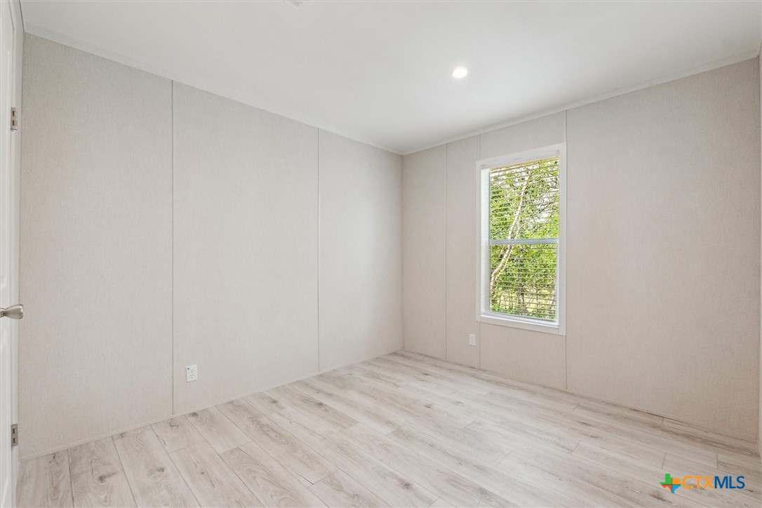 855 Roosevelt Road Luling, TX 78648 - Photo 28 of 47 an empty room with a window