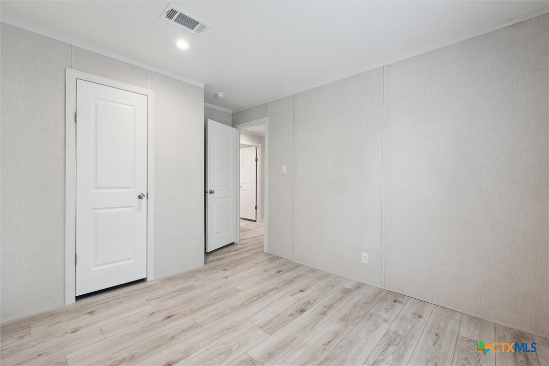 855 Roosevelt Road Luling, TX 78648 - Photo 31 of 47 a view of an empty room and wooden floor