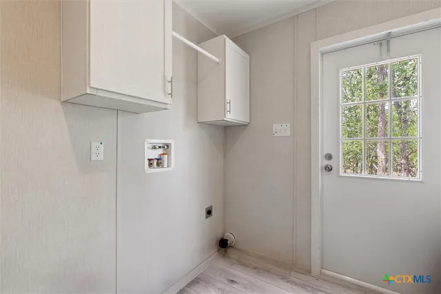 a view of room with window and hallway