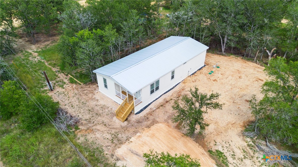 855 Roosevelt Road Luling, TX 78648 - Photo 37 of 47 a view of a small house with a yard