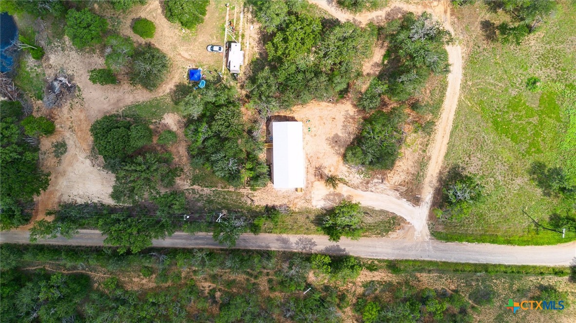 855 Roosevelt Road Luling, TX 78648 - Photo 41 of 47 an aerial view of a house with a yard and lake view