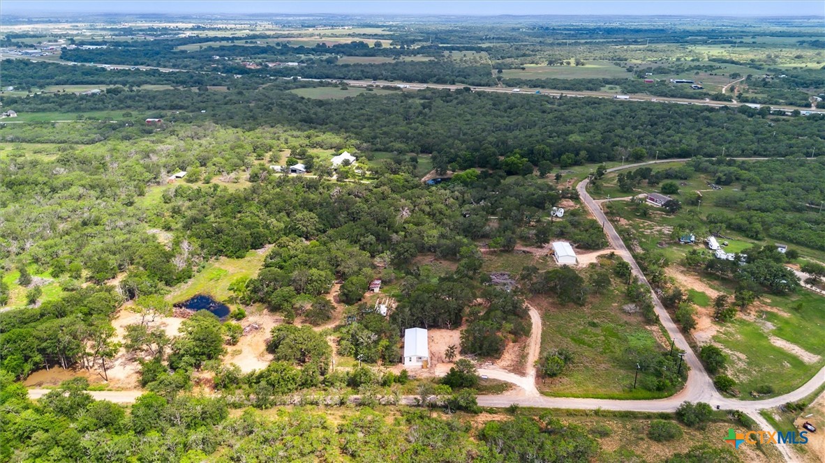 855 Roosevelt Road Luling, TX 78648 - Photo 43 of 47 an aerial view of residential houses with outdoor space and trees