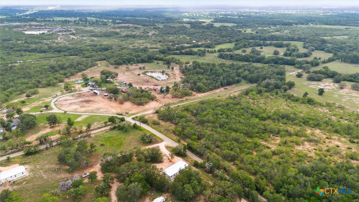 855 Roosevelt Road Luling, TX 78648 - Photo 45 of 47 an aerial view of residential houses with outdoor space and trees