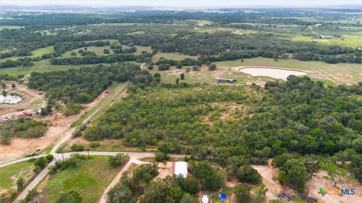 855 Roosevelt Road Luling, TX 78648 - Photo 46 of 47 an aerial view of residential houses with outdoor space and trees