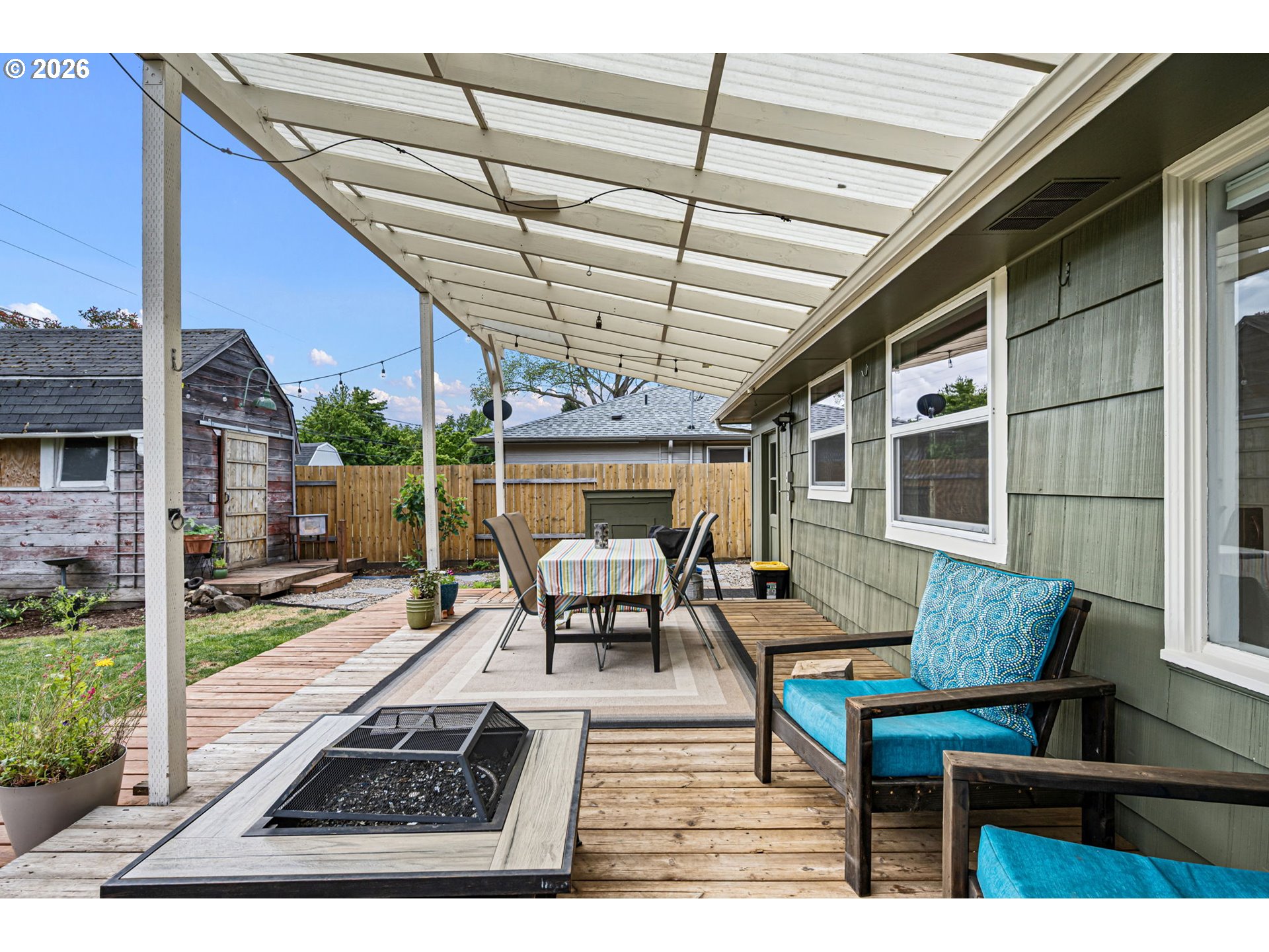 765 Louis Street Eugene, OR 97402 - Photo 32 of 45 a outdoor space with patio the couches and a dining table with the view of the ocean