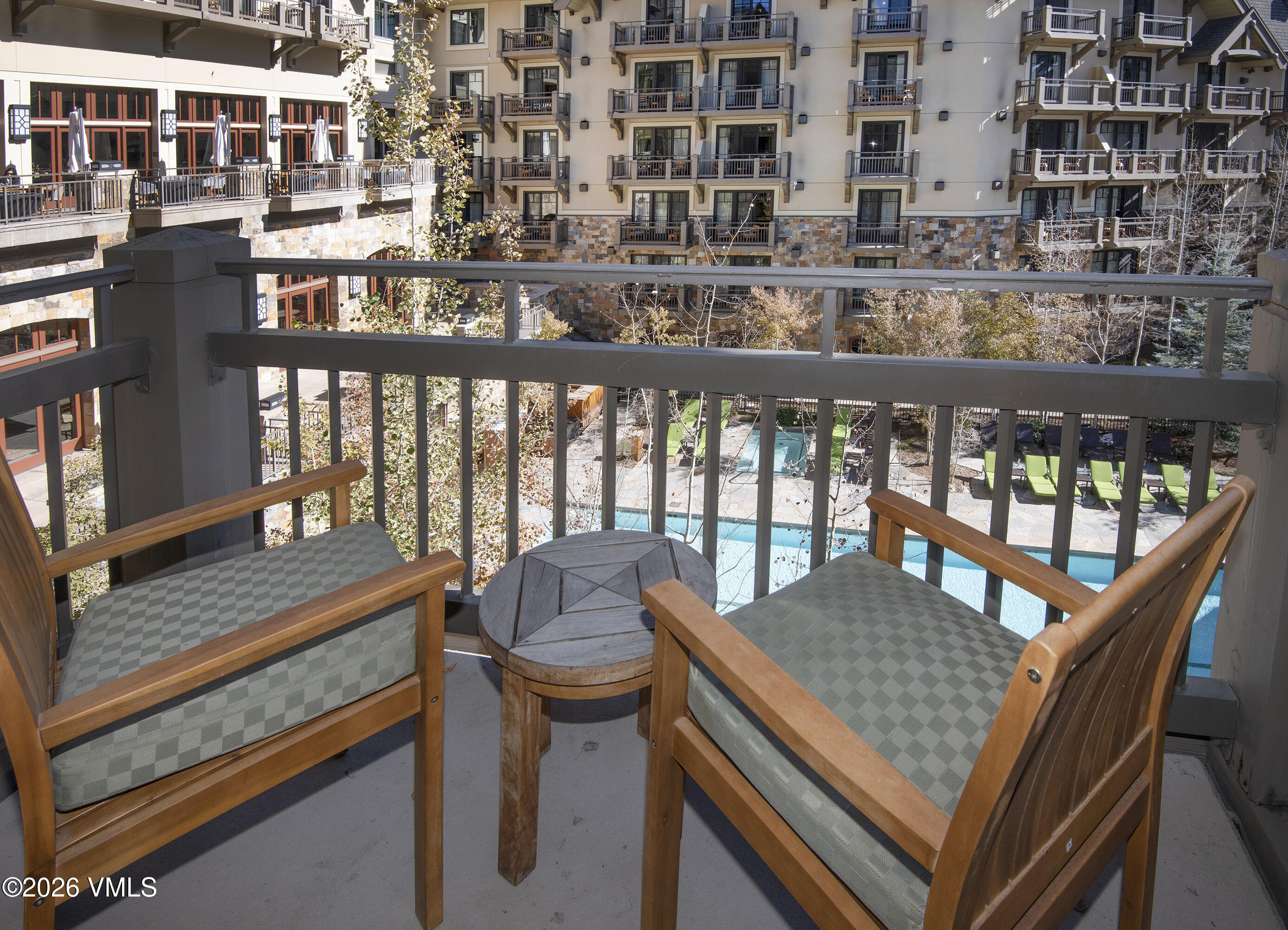 1 Vail Road, Unit 5102C Vail, CO 81657 - Photo 11 of 13 a view of a balcony dining table and chairs