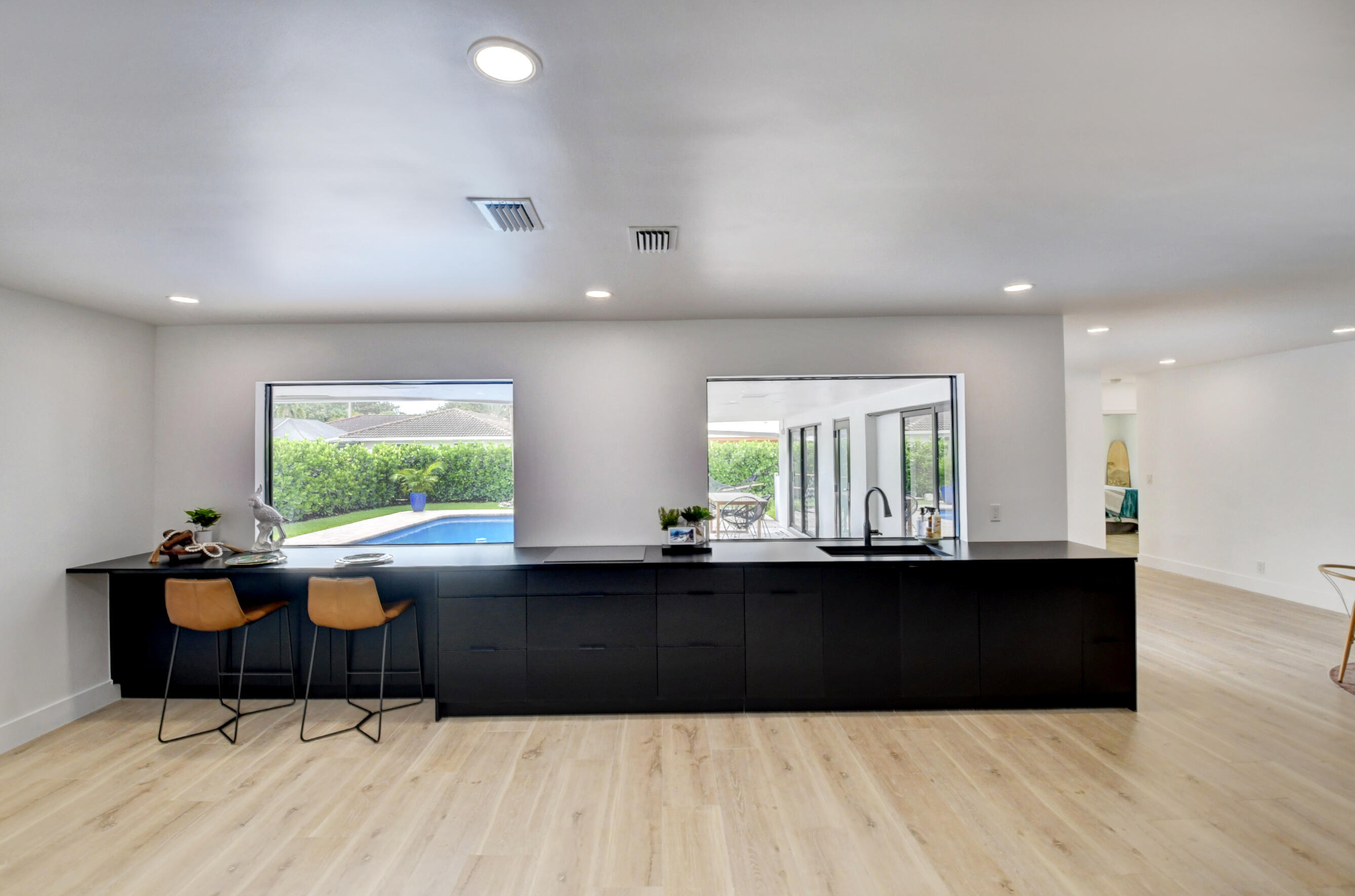 1270 Southwest 13th Drive Boca Raton, FL 33486 - Photo 12 of 23 a living room with a table and a large window