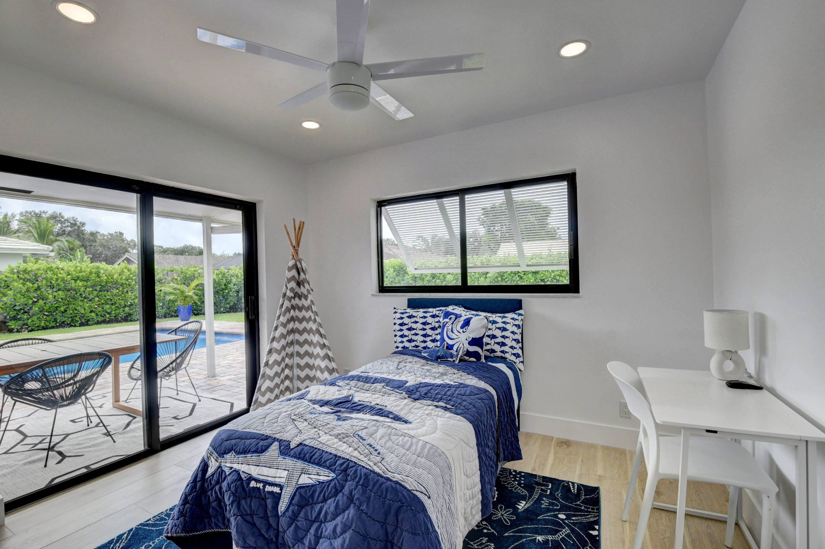 1270 Southwest 13th Drive Boca Raton, FL 33486 - Photo 16 of 23 a bedroom with a large bed and a window