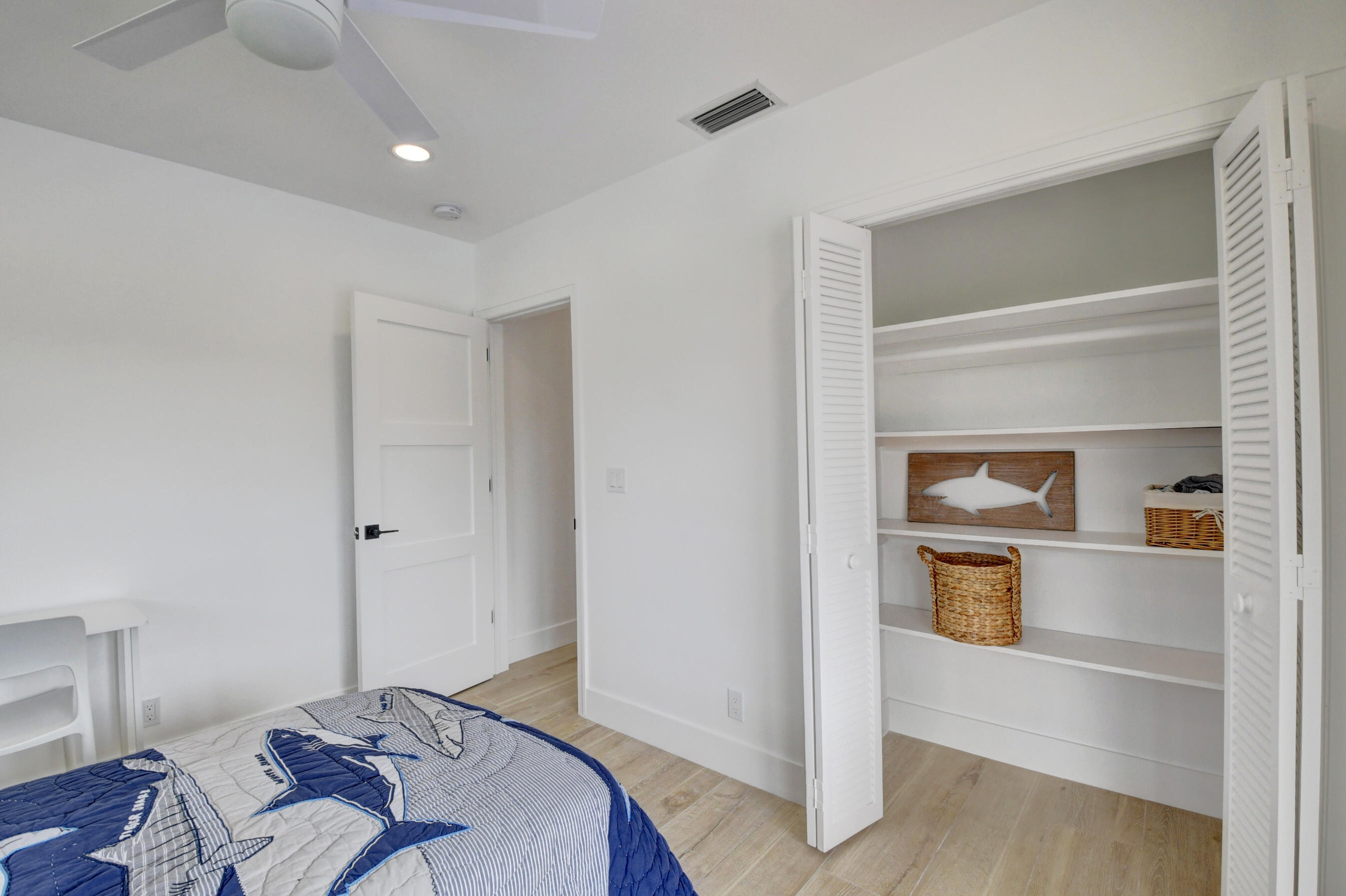 1270 Southwest 13th Drive Boca Raton, FL 33486 - Photo 17 of 23 a bedroom with a bed and a closet