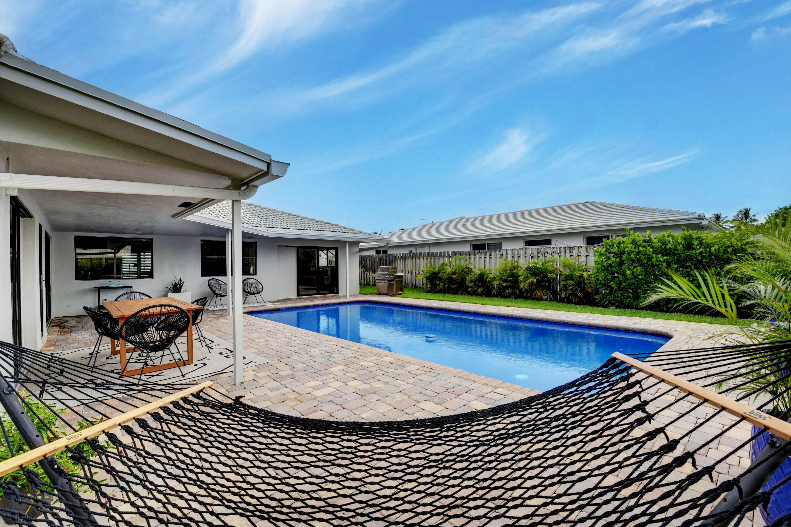 1270 Southwest 13th Drive Boca Raton, FL 33486 - Photo 2 of 23 a view of swimming pool with seating space