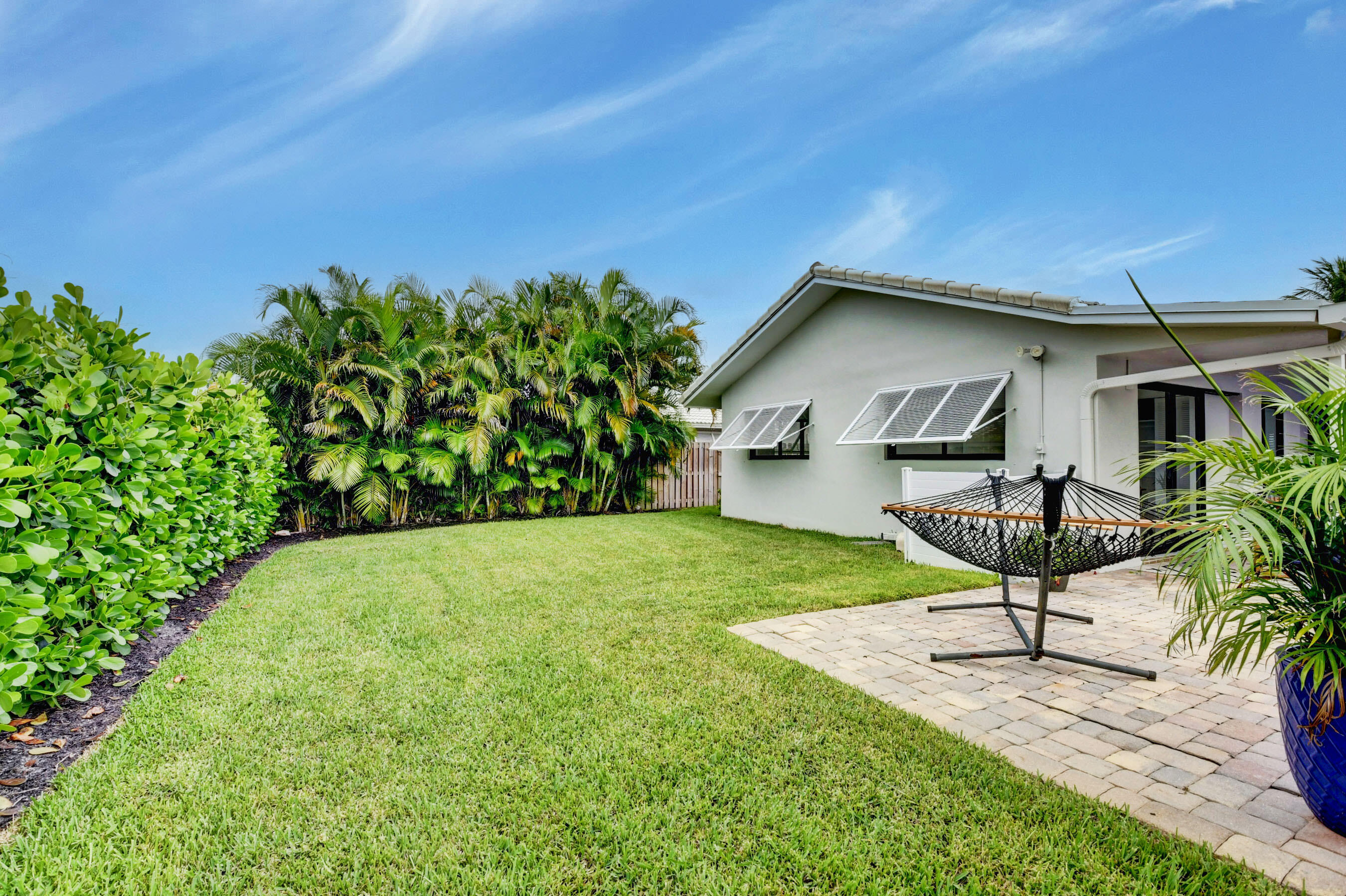1270 Southwest 13th Drive Boca Raton, FL 33486 - Photo 4 of 23 a house view with a garden space