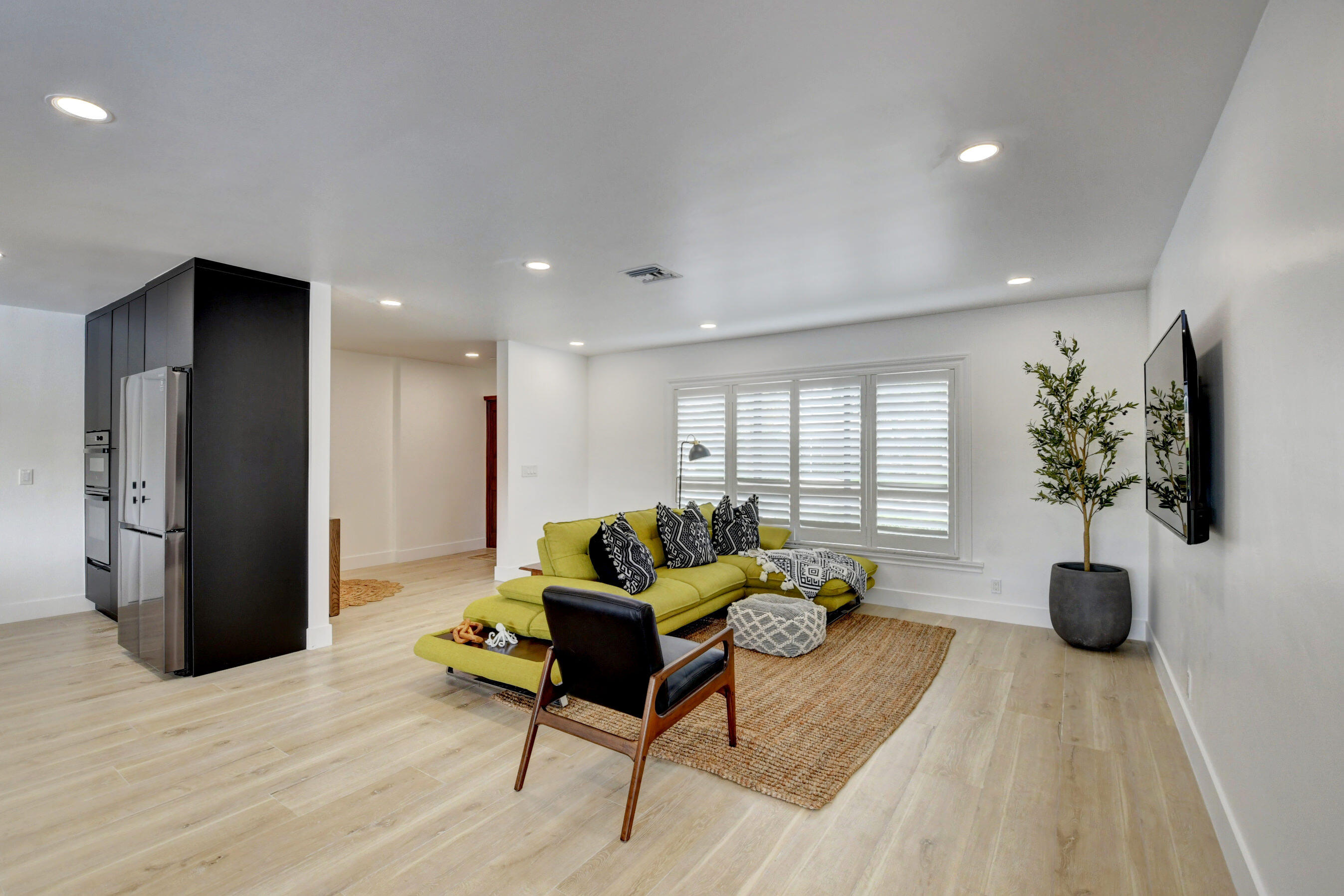 1270 Southwest 13th Drive Boca Raton, FL 33486 - Photo 5 of 23 a living room with furniture and a potted plant