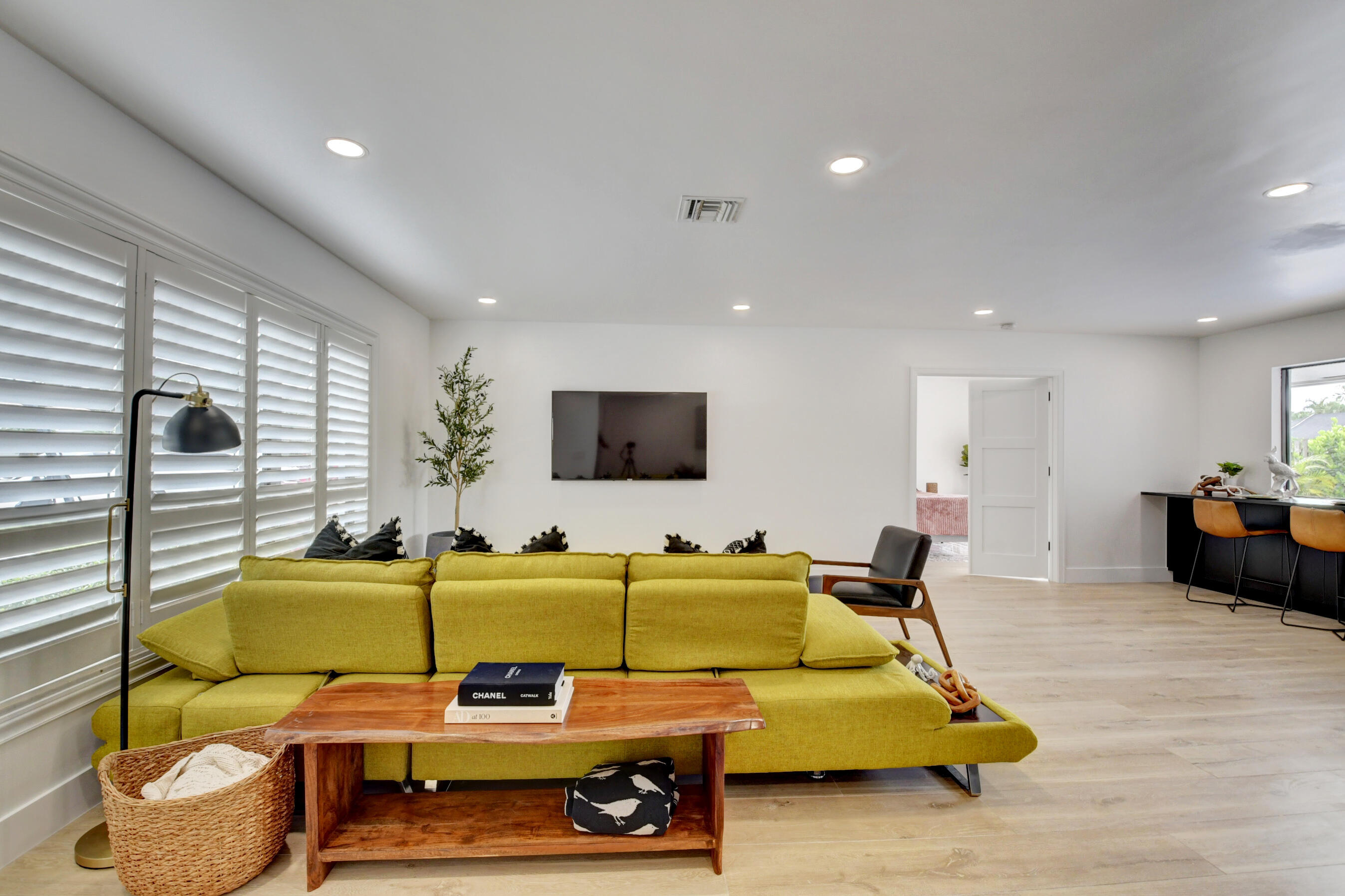1270 Southwest 13th Drive Boca Raton, FL 33486 - Photo 7 of 23 a living room with furniture and a flat screen tv