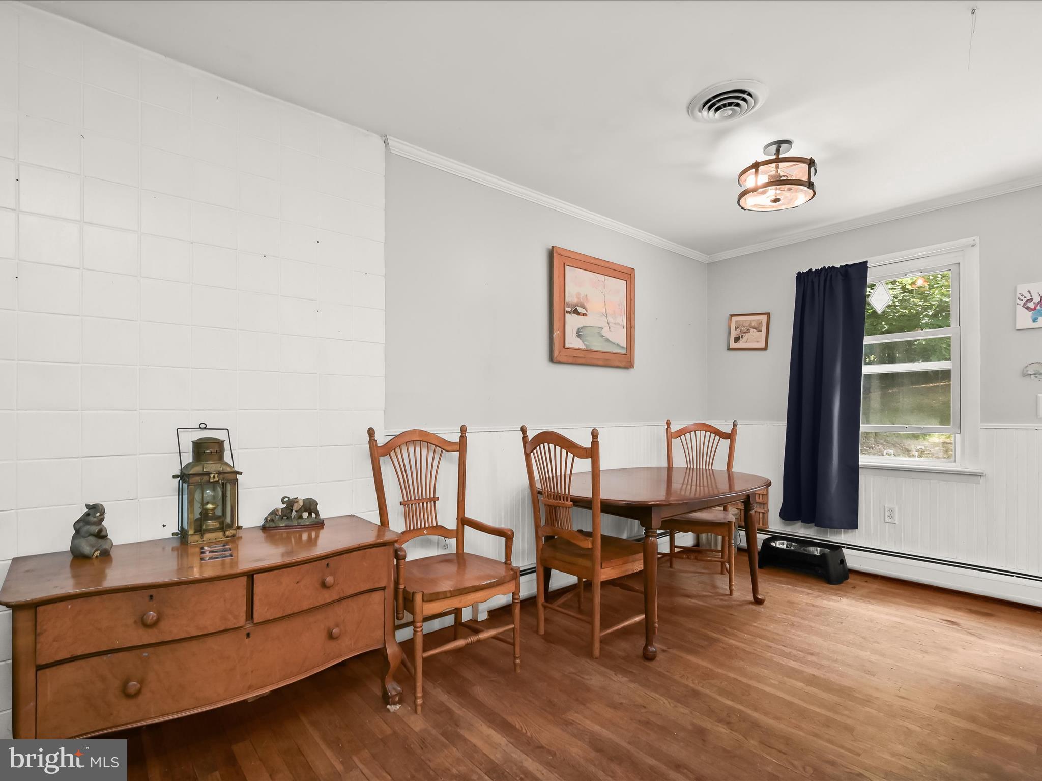 17515 Masemore Road Parkton, MD 21120 - Photo 11 of 36 a view of a workspace with furniture and a window