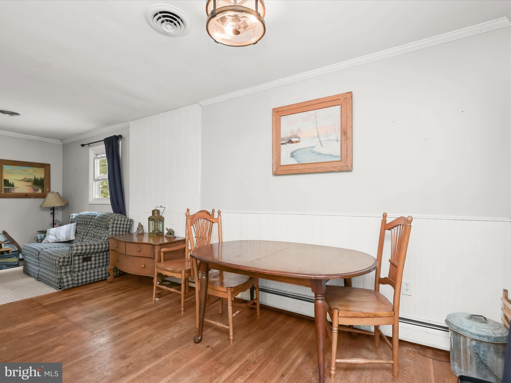 17515 Masemore Road Parkton, MD 21120 - Photo 12 of 36 a dining room with furniture and wooden floor