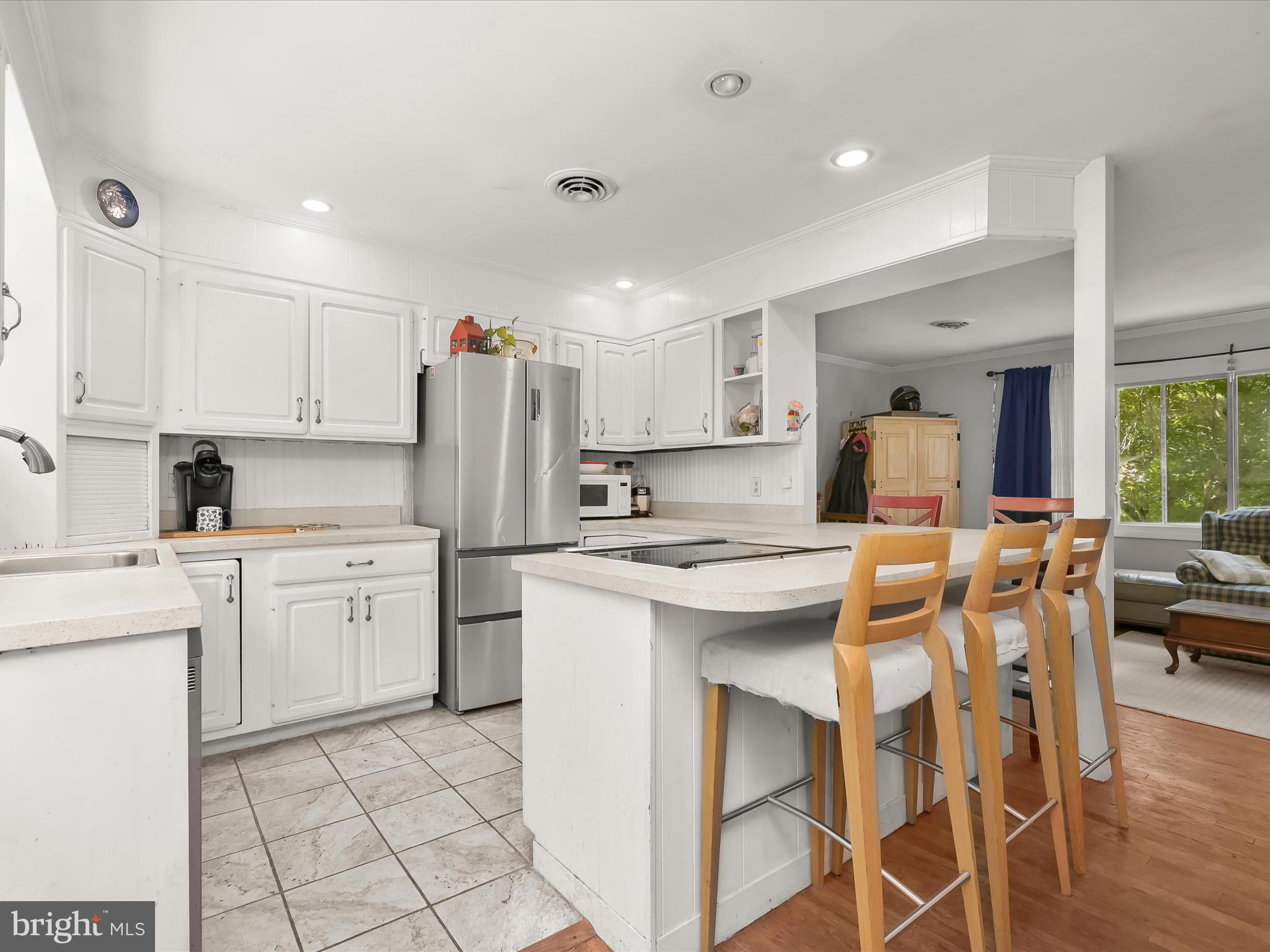 17515 Masemore Road Parkton, MD 21120 - Photo 13 of 36 a kitchen that has a lot of white cabinets and stainless steel appliances