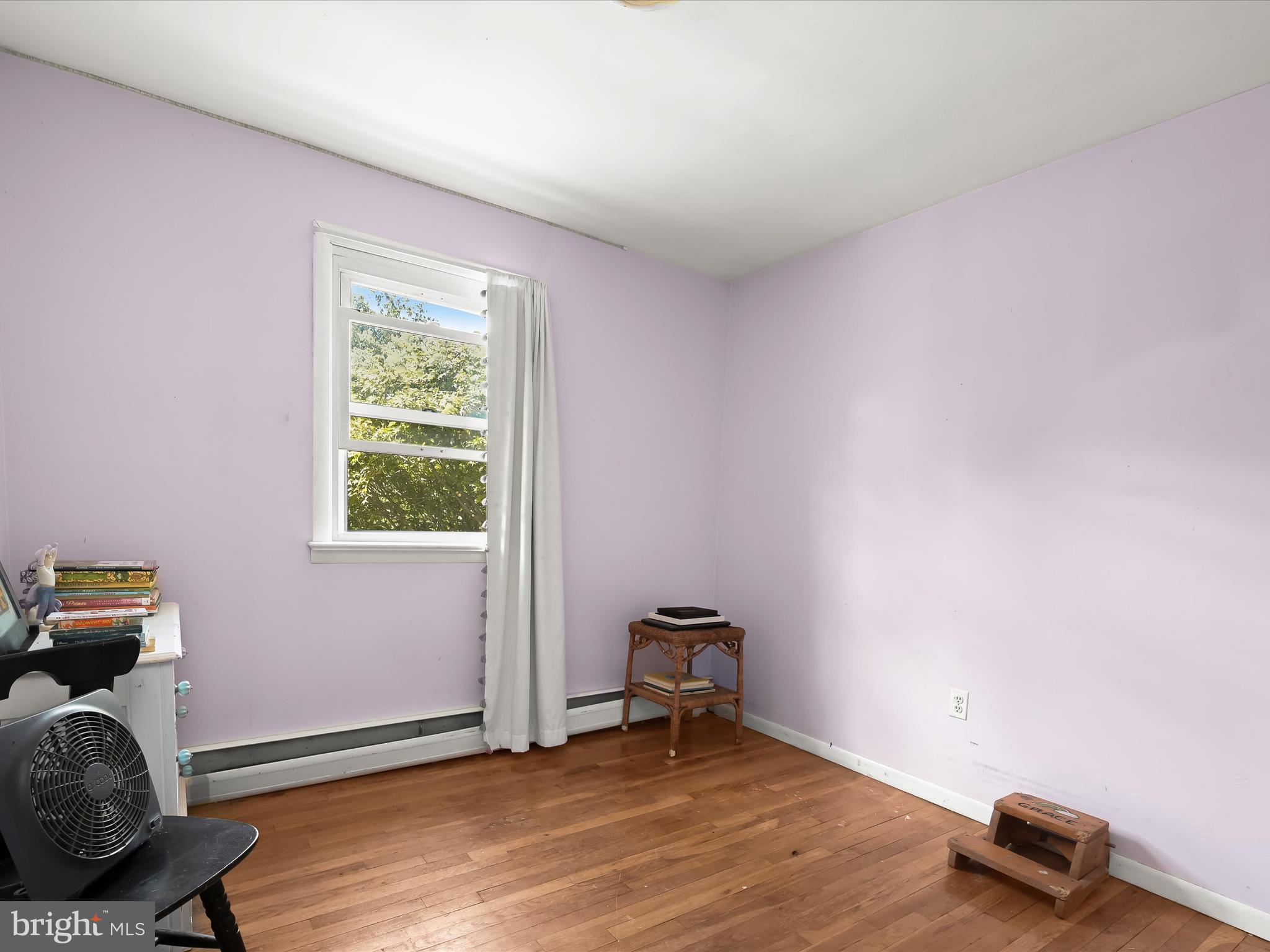 17515 Masemore Road Parkton, MD 21120 - Photo 18 of 36 a view of an empty room with a window and wooden floor
