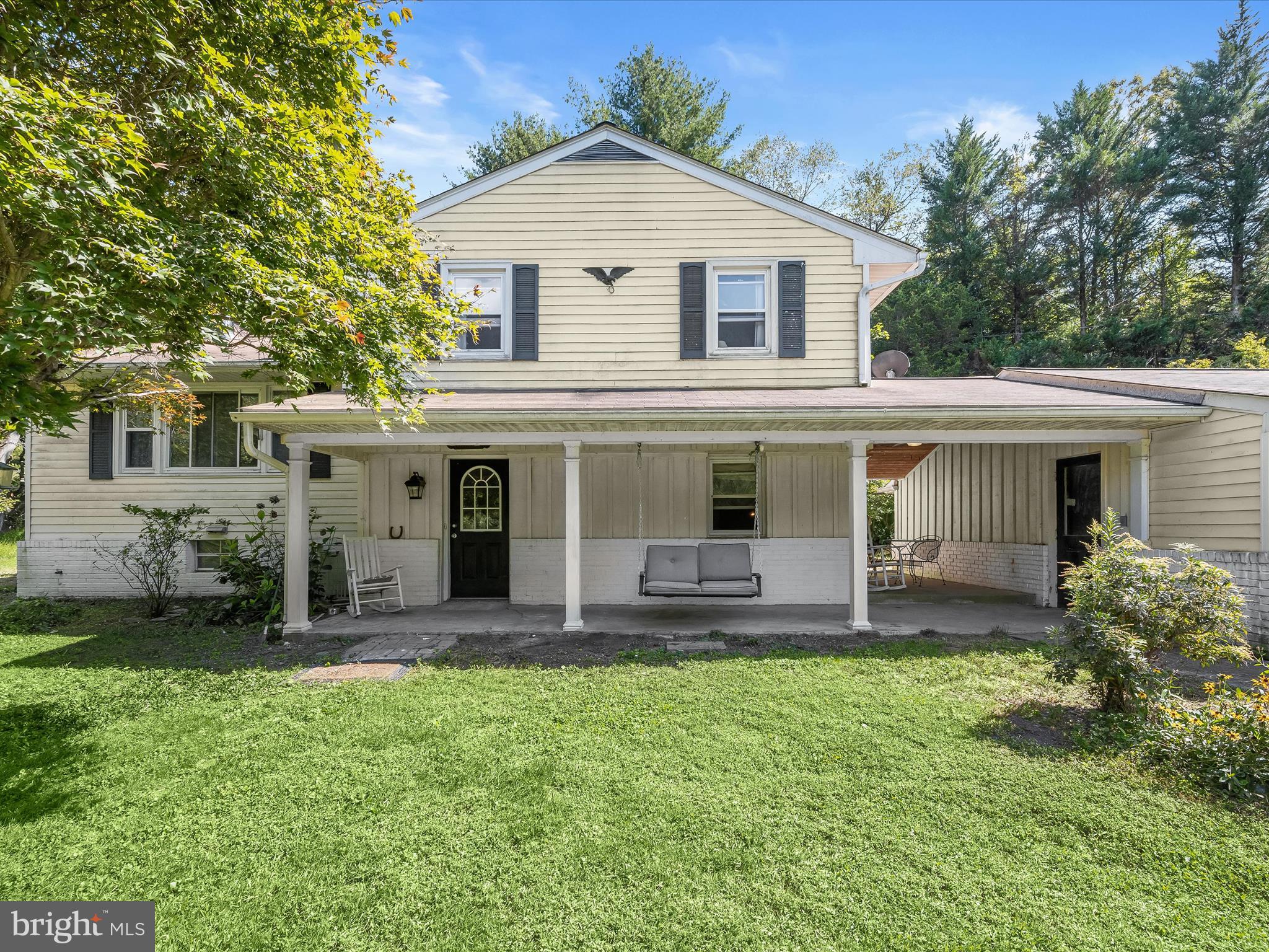 17515 Masemore Road Parkton, MD 21120 - Photo 2 of 36 a front view of a house with a yard and garage