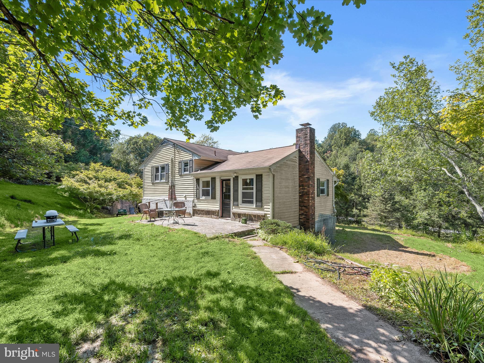 17515 Masemore Road Parkton, MD 21120 - Photo 23 of 36 a front view of a house with swimming pool having outdoor seating