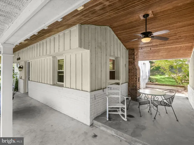 a very nice looking dining room with a large window