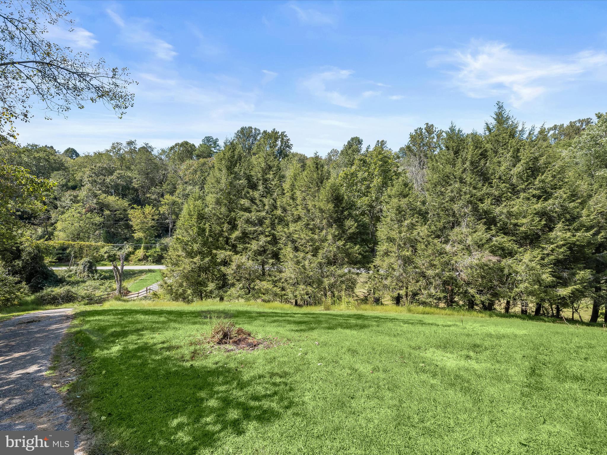 17515 Masemore Road Parkton, MD 21120 - Photo 30 of 36 a view of a green field with wooden fence