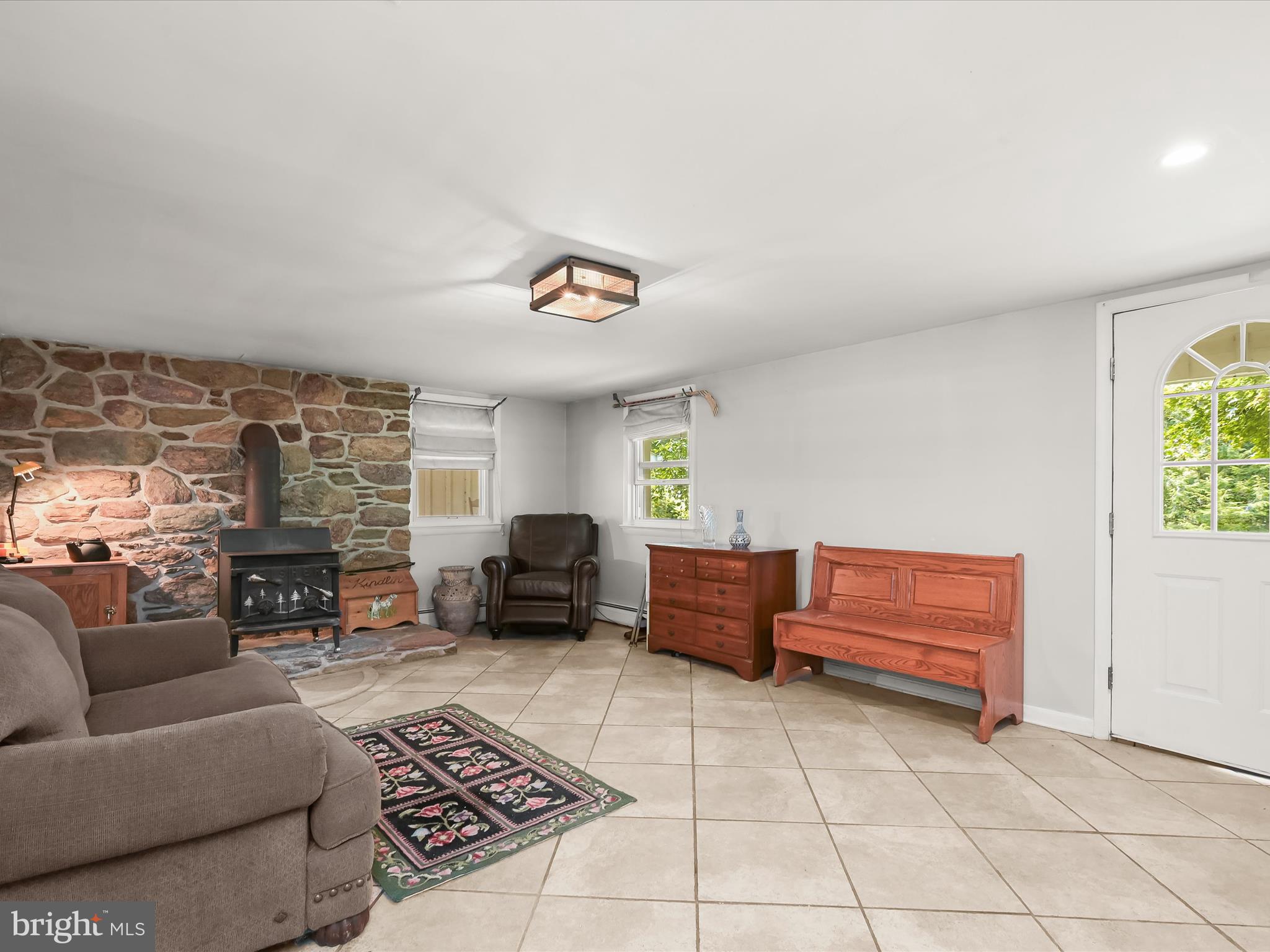 17515 Masemore Road Parkton, MD 21120 - Photo 5 of 36 a living room with furniture and a fireplace