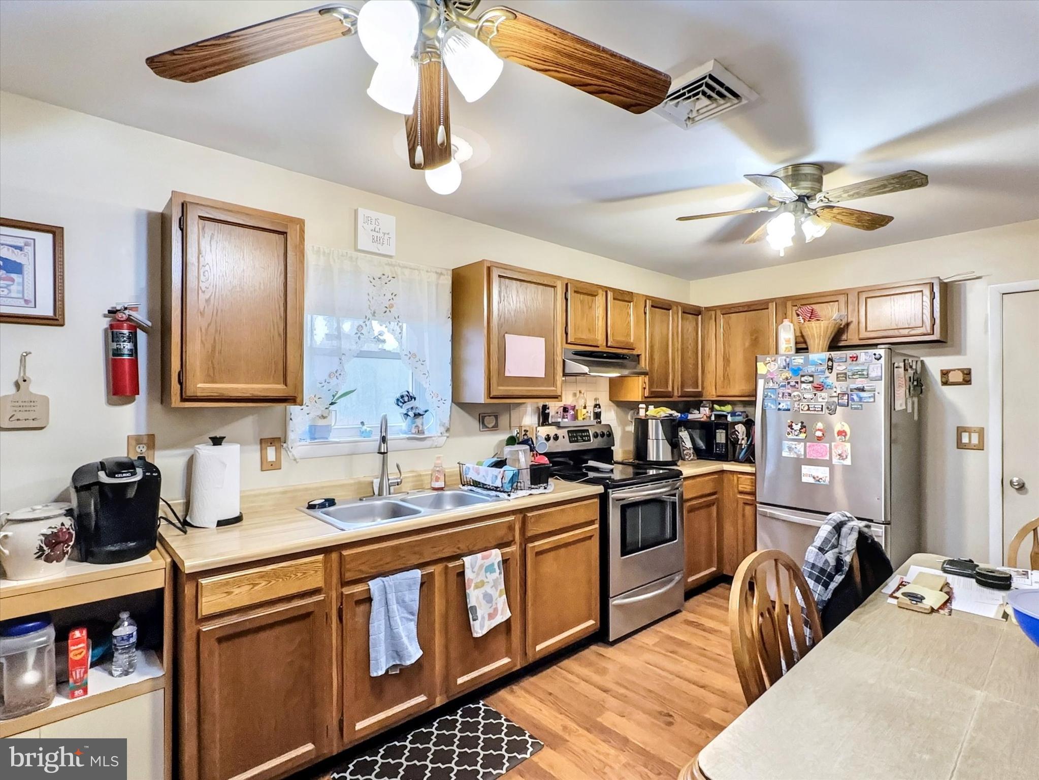 1392 Manor Road Windsor, PA 17366 - Photo 7 of 22 a kitchen that has a lot of cabinets a sink and appliances