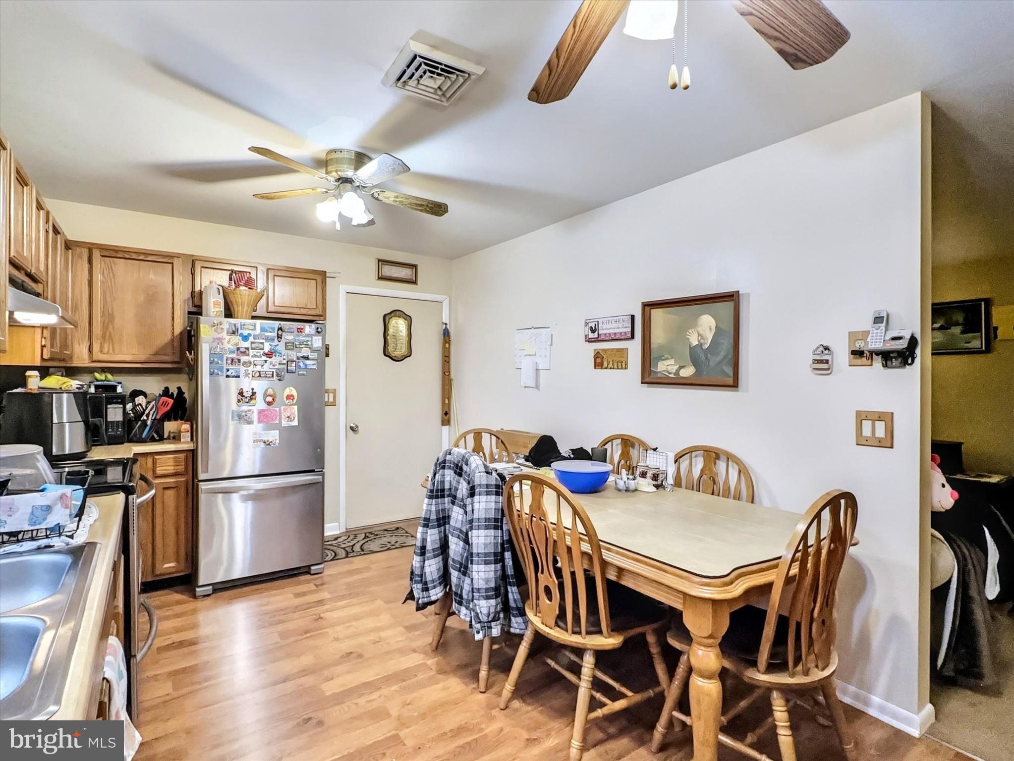 1392 Manor Road Windsor, PA 17366 - Photo 8 of 22 a view of a dining room with furniture a kitchen and chandelier