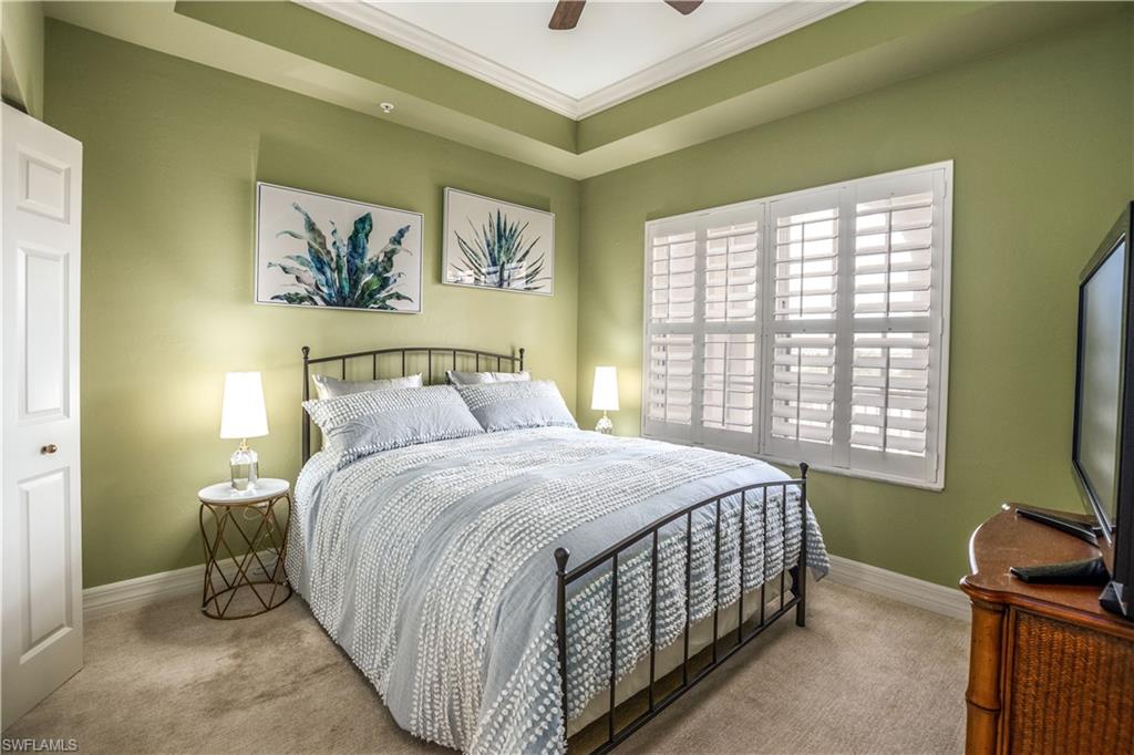 450 Bayfront Place, Unit 4508 Naples, FL 34102 - Photo 13 of 24 a bedroom with a bed and a flat screen tv