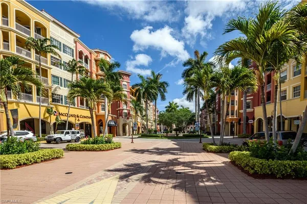 a swimming pool with outdoor seating and yard