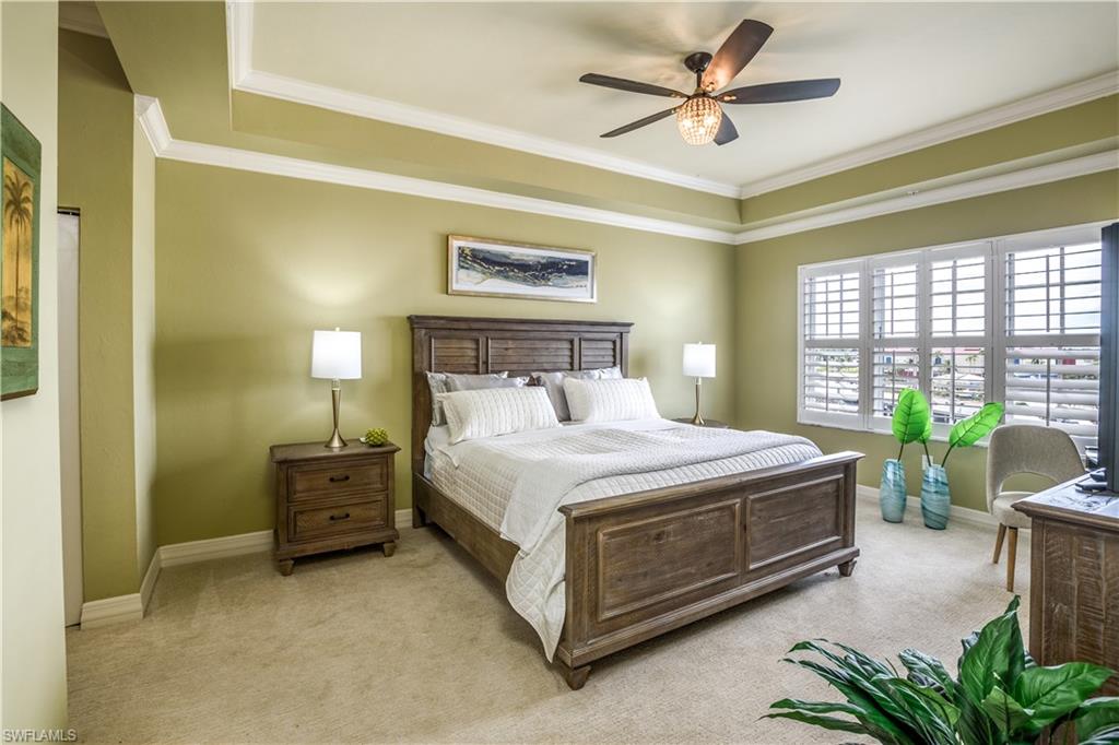 450 Bayfront Place, Unit 4508 Naples, FL 34102 - Photo 7 of 24 a bedroom with a bed dresser and a window