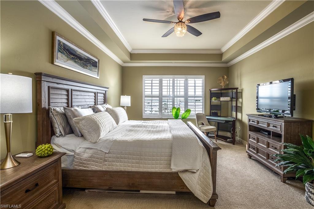 450 Bayfront Place, Unit 4508 Naples, FL 34102 - Photo 8 of 24 a bedroom with a bed flat screen tv and a large window