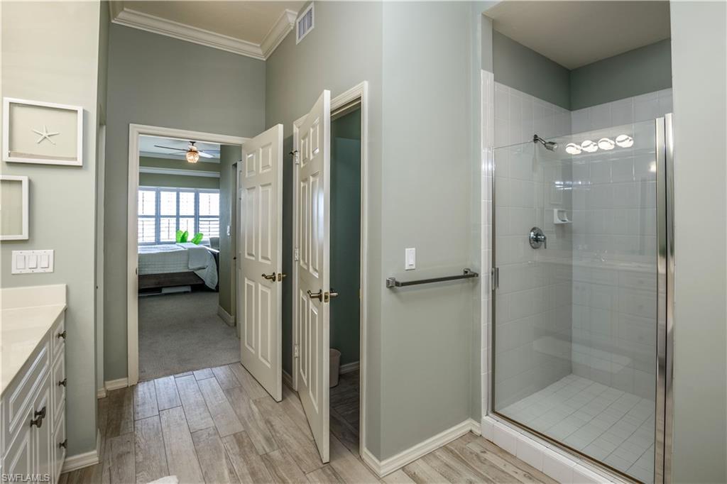 450 Bayfront Place, Unit 4508 Naples, FL 34102 - Photo 10 of 24 a en suite bathroom with a glass shower door and a window