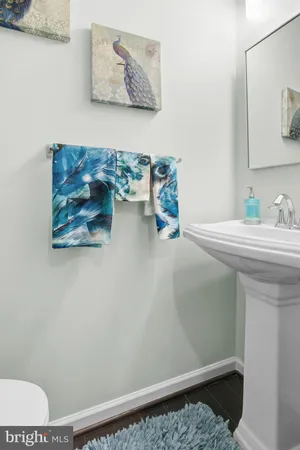 a bathroom with a sink and a window