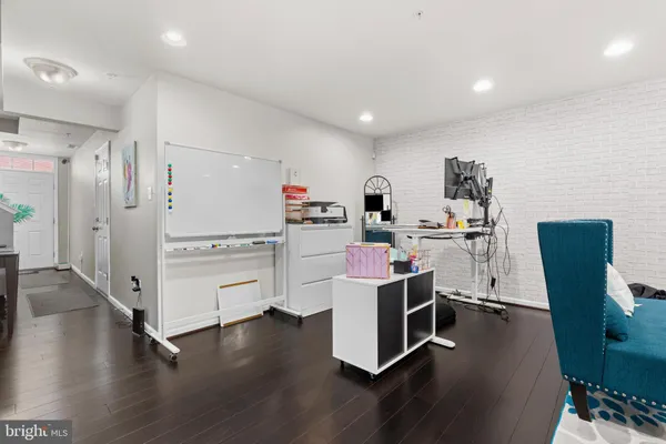 a room with cabinets and wooden floor